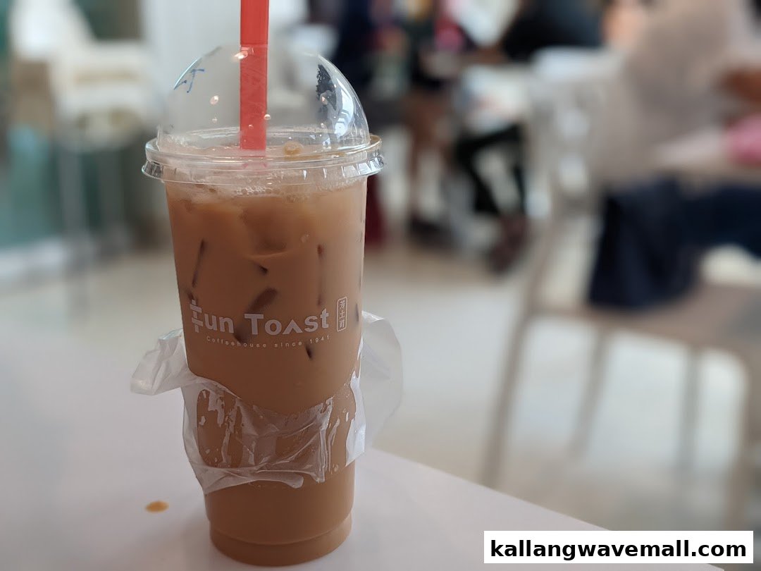 A refreshing iced coffee drink from Fun Toast, served in a clear cup with a red straw.