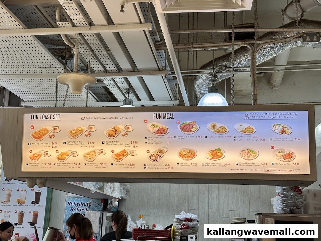 A brightly lit digital menu board at Fun Toast showcasing a variety of toast sets and local meals.