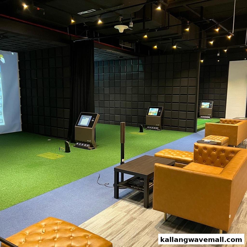 Indoor golf simulation bays with comfortable seating and interactive screens.