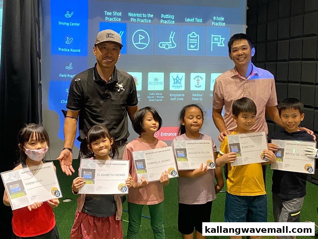 Children and instructors proudly display golf participation certificates in an indoor golf center.