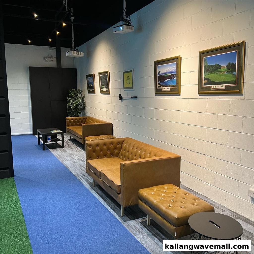 A comfortable lounge area with golf-themed decor and seating, likely part of a golf simulation facility.