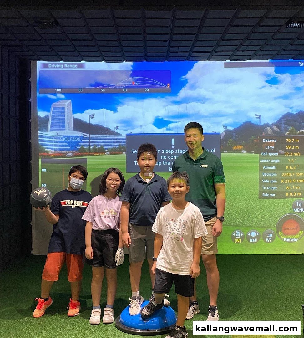 People, including children and an adult, enjoying a golf simulator session at Golfwav.