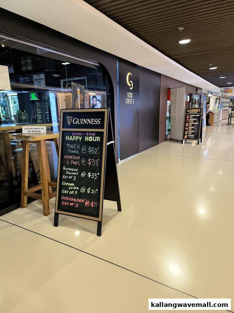 A shop entrance featuring a chalkboard displaying happy hour drink specials.