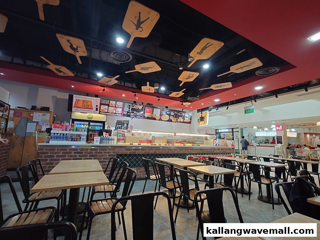 Interior view of Gourmet Pizza To Go! with seating, counter, and menu boards.