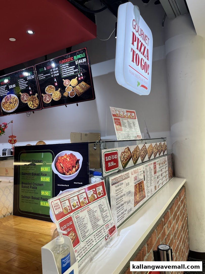 A vibrant counter at Gourmet Pizza To Go! showcasing various menu options and delicious food displays.