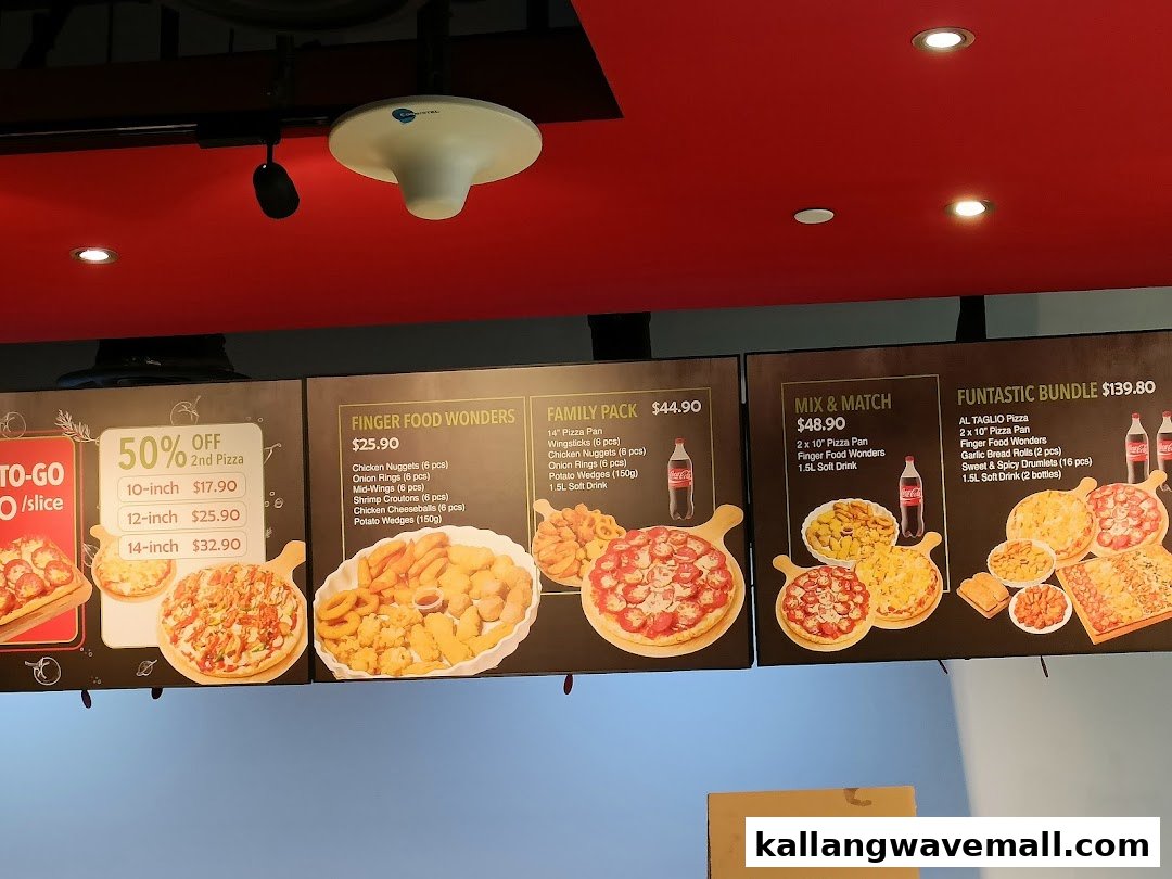Digital menu boards displaying pizza deals, finger foods, and family bundles at Gourmet Pizza To Go.