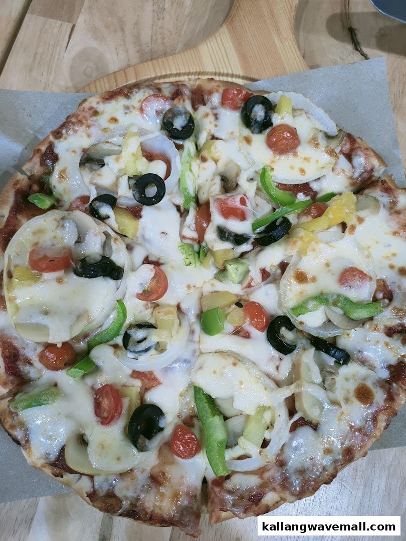 A delicious, freshly baked pizza topped with cheese, vegetables, and olives.