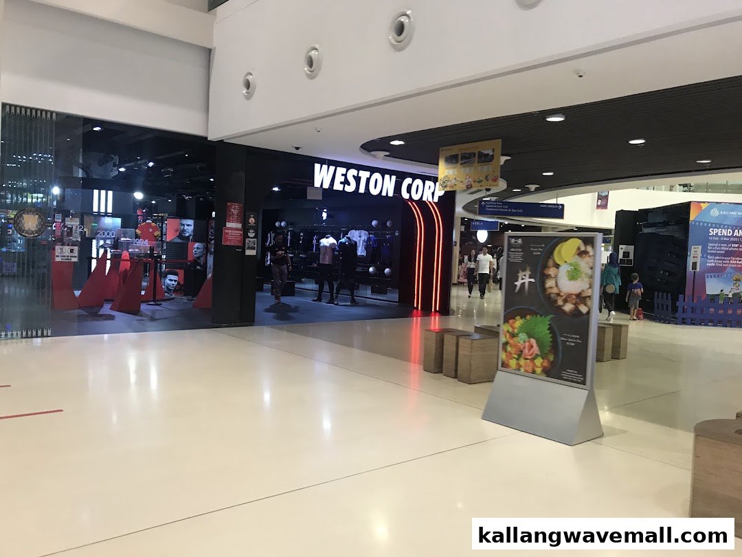 The entrance of Weston Corp, a sports apparel and equipment store, with bright displays and neon accents.