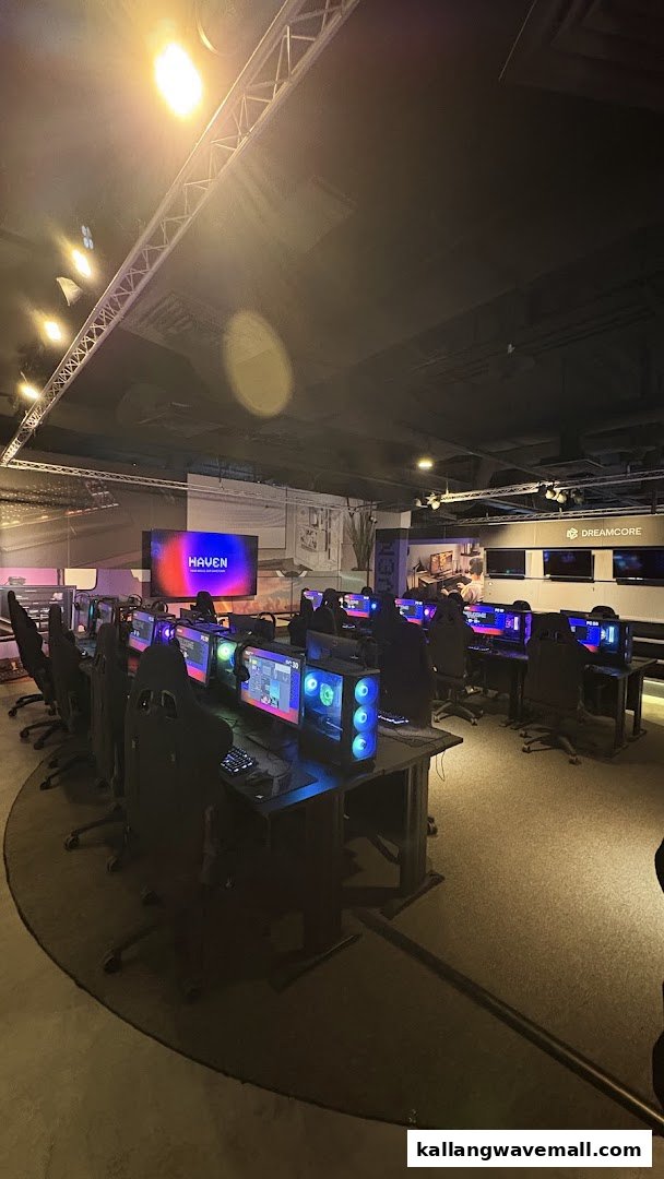 Interior view of HAVEN Esports LAN Cafe with multiple gaming stations and large screens.