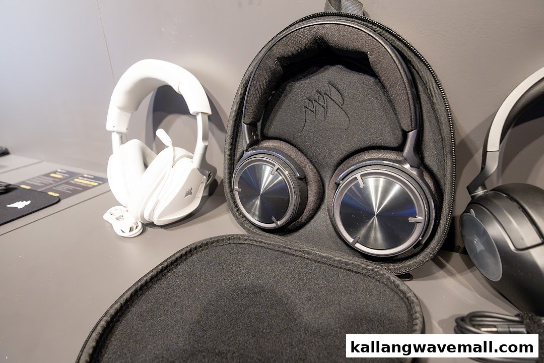 A display of premium gaming headsets, including white and black models, some in protective cases.