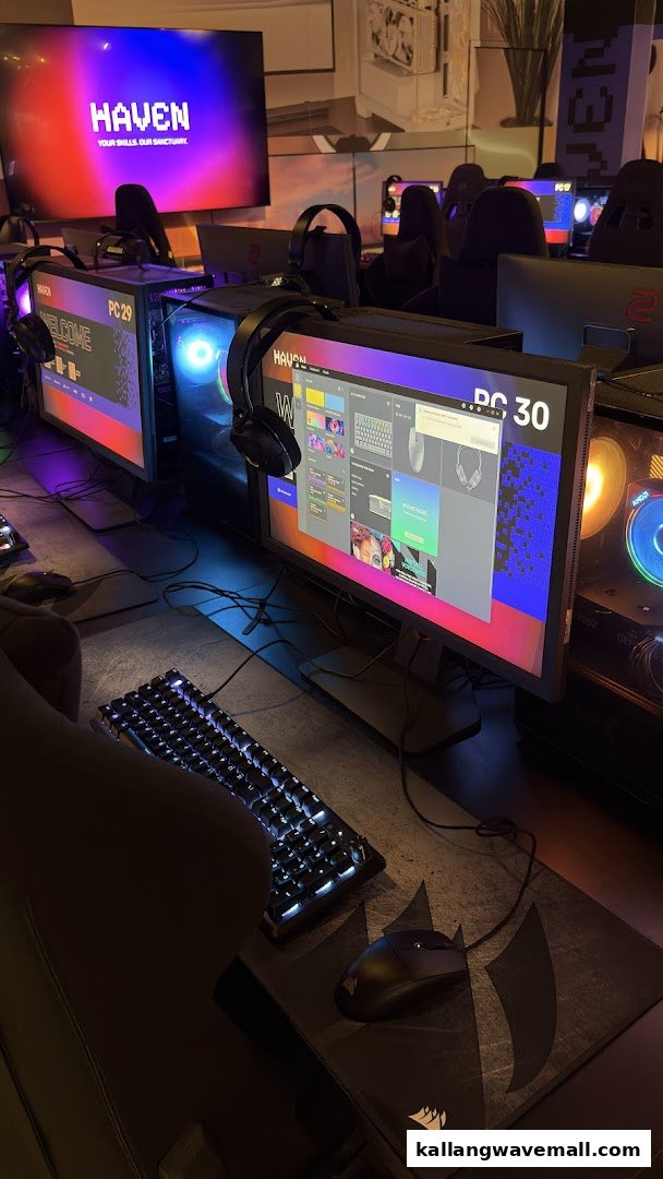 Interior view of a modern LAN cafe with multiple gaming stations, high-performance PCs, and RGB lighting.