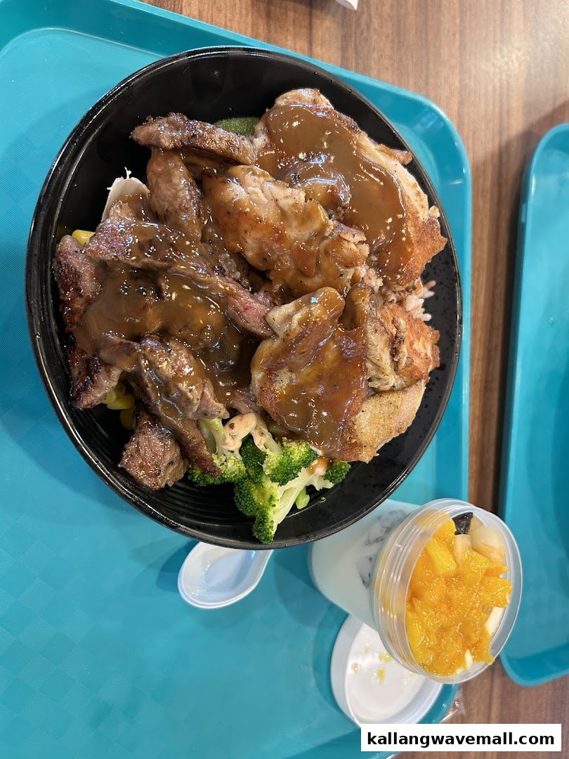A hearty meal bowl featuring grilled meats, vegetables, and gravy, served with a side of fruit yogurt.