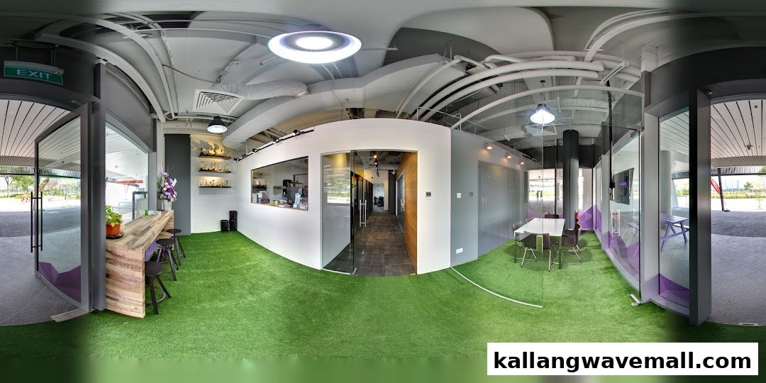 A modern indoor facility with artificial turf, reception area, and meeting rooms, designed for sports training.
