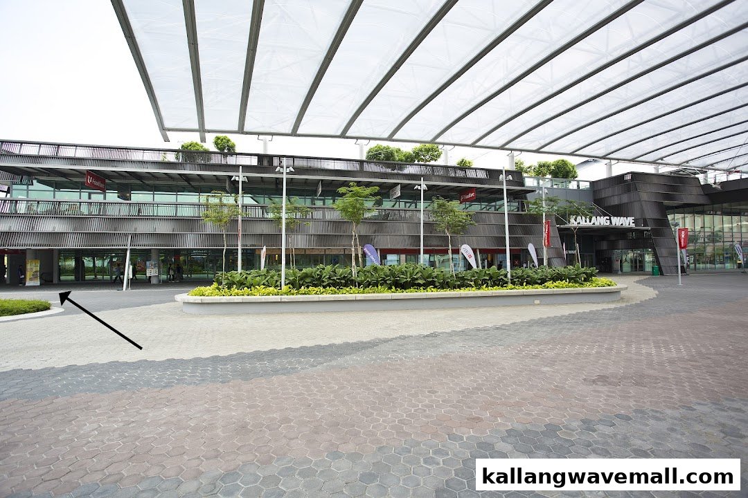 The modern exterior of the Kallang Wave building, a hub for sports and lifestyle activities.