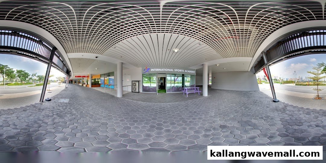 The modern entrance of International Sports Academy ISA with a purple bench outside.