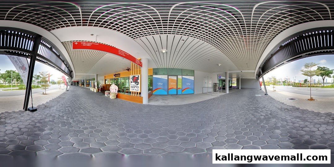 A panoramic view of a modern outdoor retail and leisure promenade with various shop fronts.