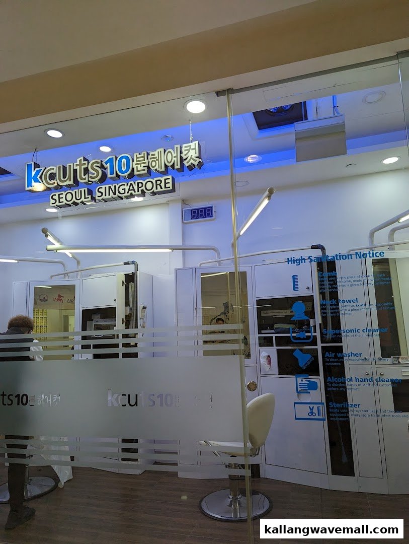 The storefront of kcuts 10분헤어컷, a Korean-style express hair salon, featuring its logo and interior view.
