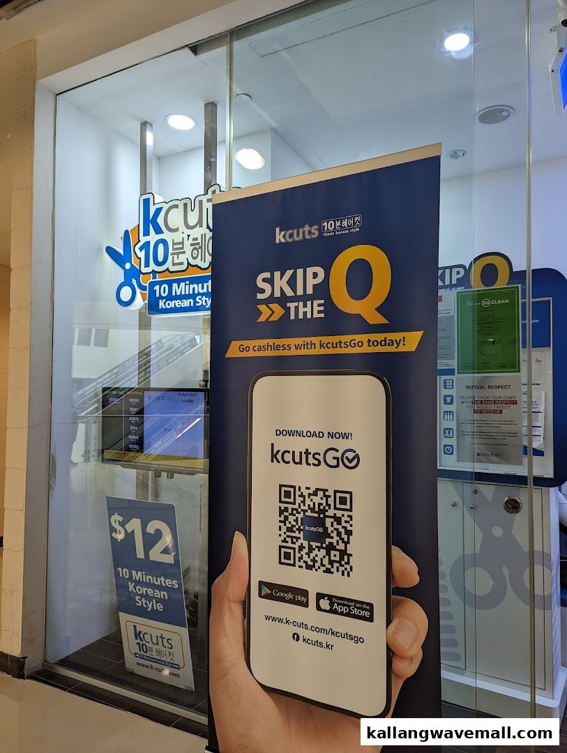 The storefront of kcuts, a hair salon offering 10-minute Korean style cuts, with promotional banners.