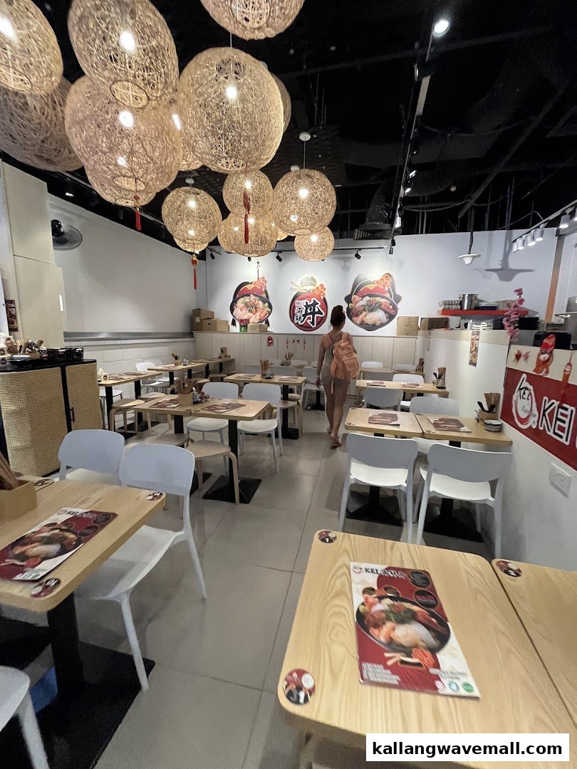 A bright and inviting interior of Kei Kaisendon with wooden tables and unique woven light fixtures.