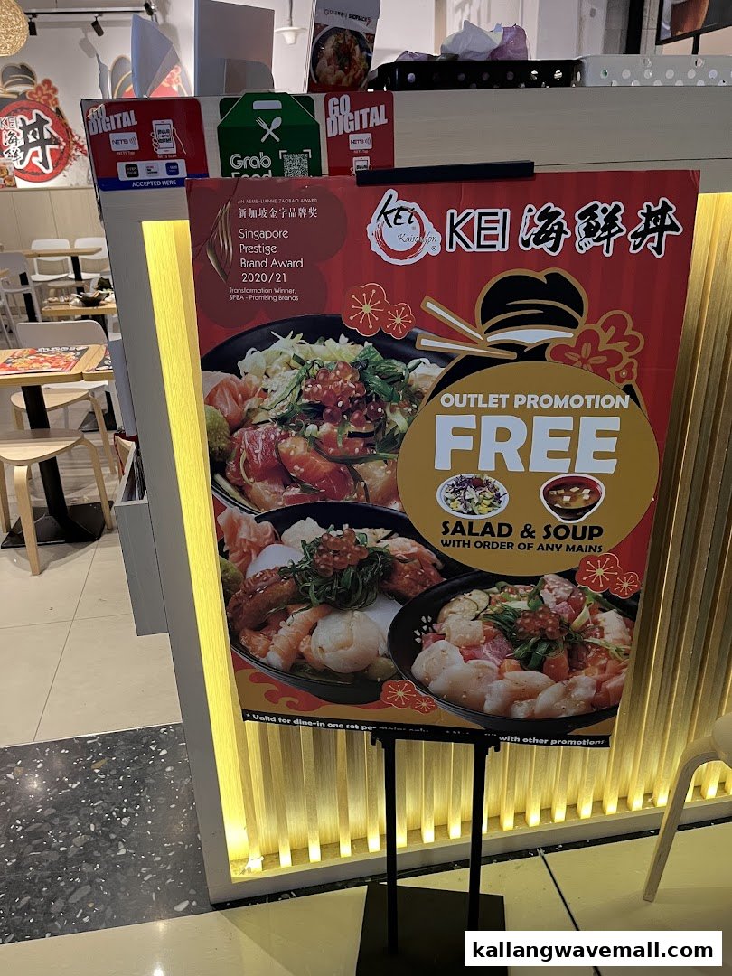 A promotional stand for Kei Kaisendon, featuring a 'Free Salad & Soup' offer and award recognition.