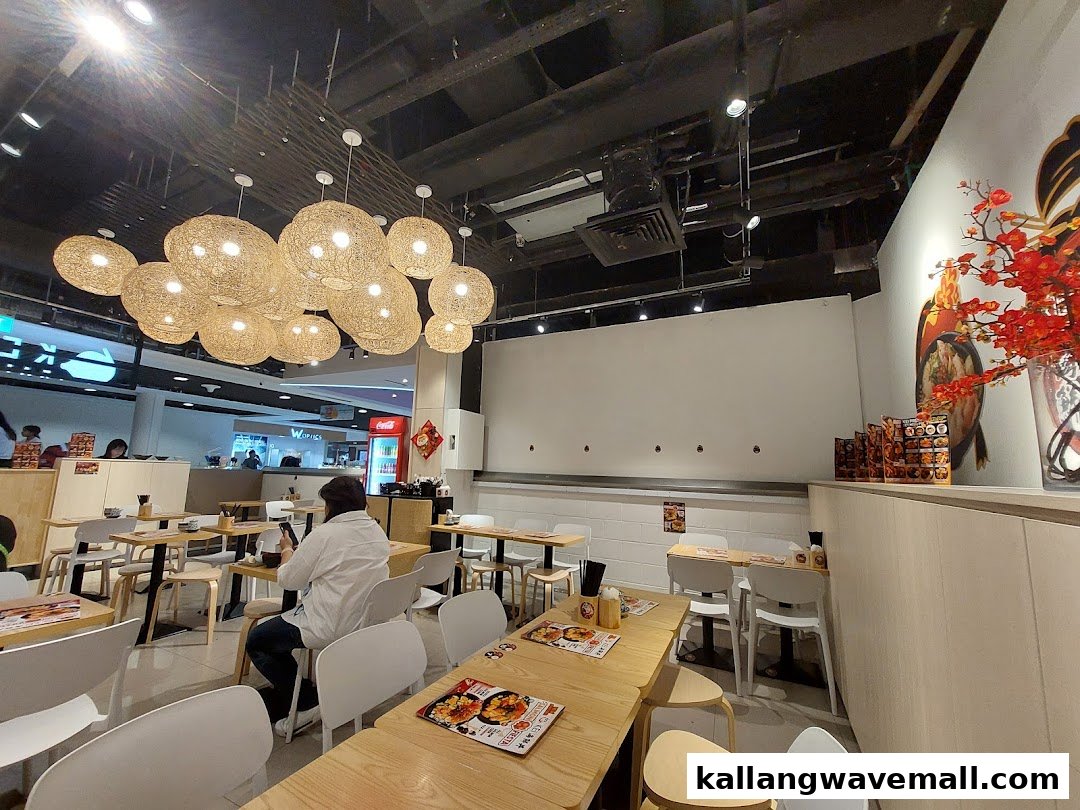 Interior view of Kei Kaisendon restaurant featuring dining tables, modern lighting, and a comfortable ambiance.