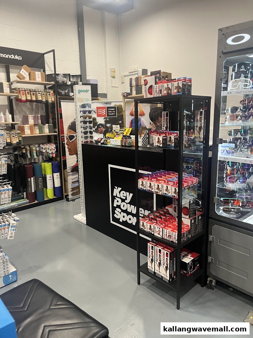 Interior view of Key Power Sports, showcasing sports accessories, yoga mats, and a service counter.