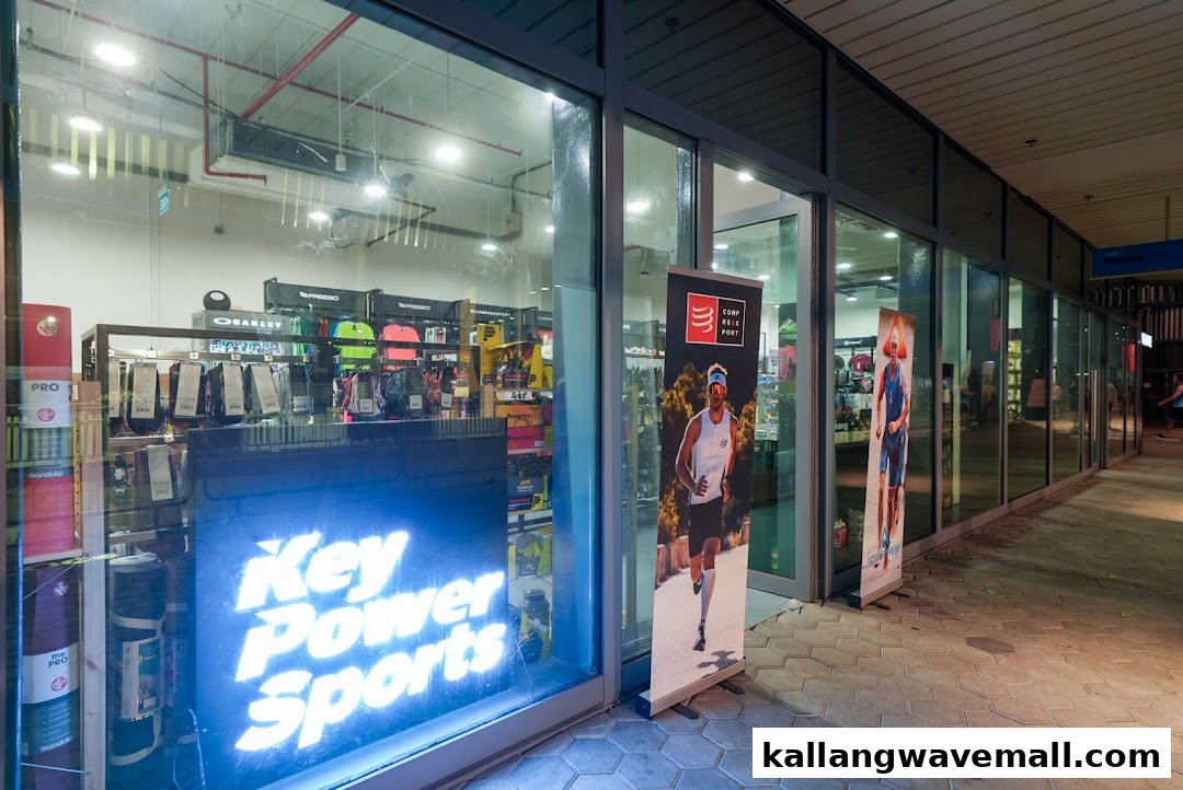 Exterior view of Key Power Sports, showcasing sports apparel and accessories through its large glass windows.