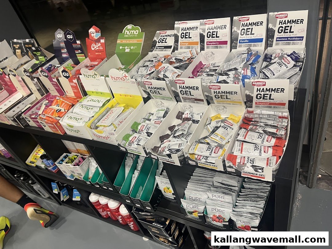 A display shelf at Key Power Sports featuring various energy gels and sports nutrition products.