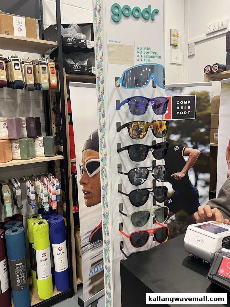 Interior view of Key Power Sports showcasing active lifestyle products like yoga mats and goodr sunglasses.