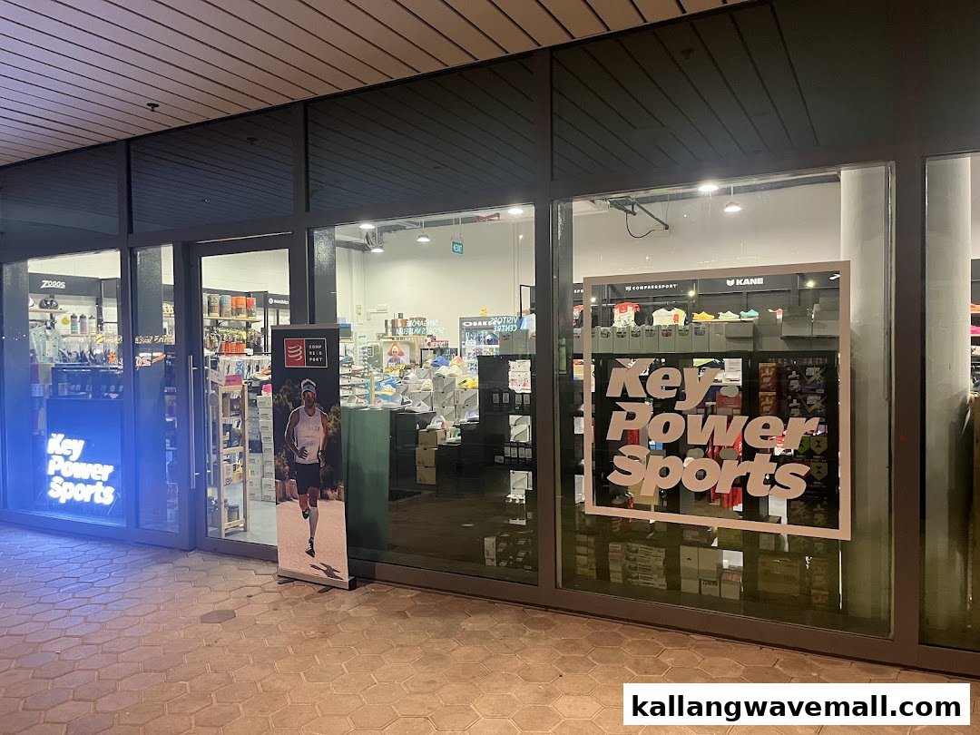 The illuminated shop front of Key Power Sports, showcasing athletic gear inside.