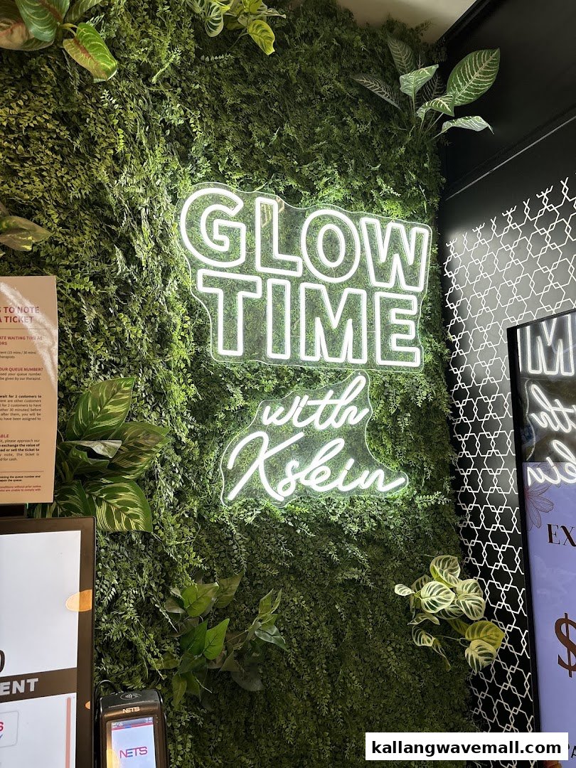 An interior shot of Kskin featuring a 'Glow Time with Kskin' neon sign on a green wall.