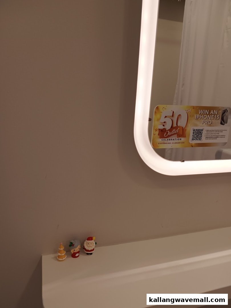 An interior shot of Kskin, featuring a mirror with a promotional sticker and festive figurines.