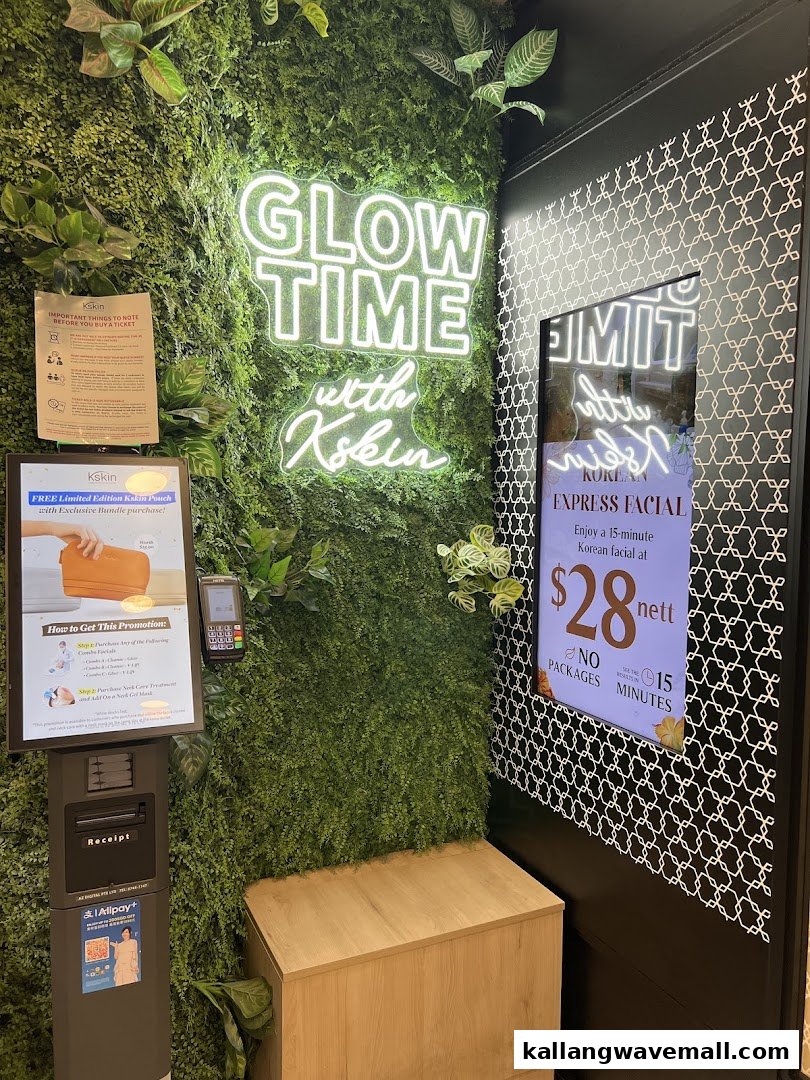 The entrance area of Kskin, featuring a vibrant 'Glow Time' neon sign and a self-service kiosk.