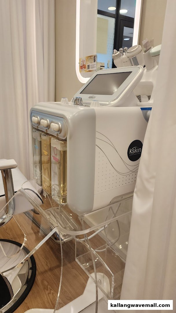 Close-up of a modern Kskin facial treatment machine with liquid reservoirs in a clean setting.