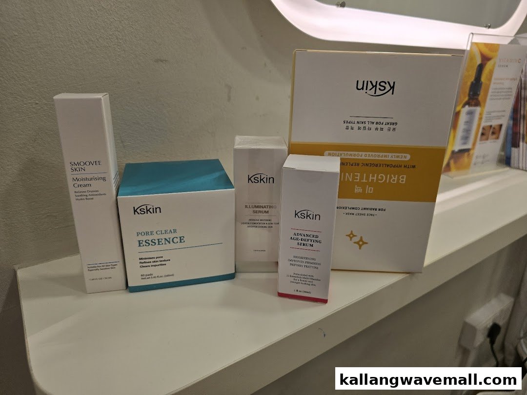 A display of Kskin skincare products, including moisturizers, essences, and serums, on a white shelf.