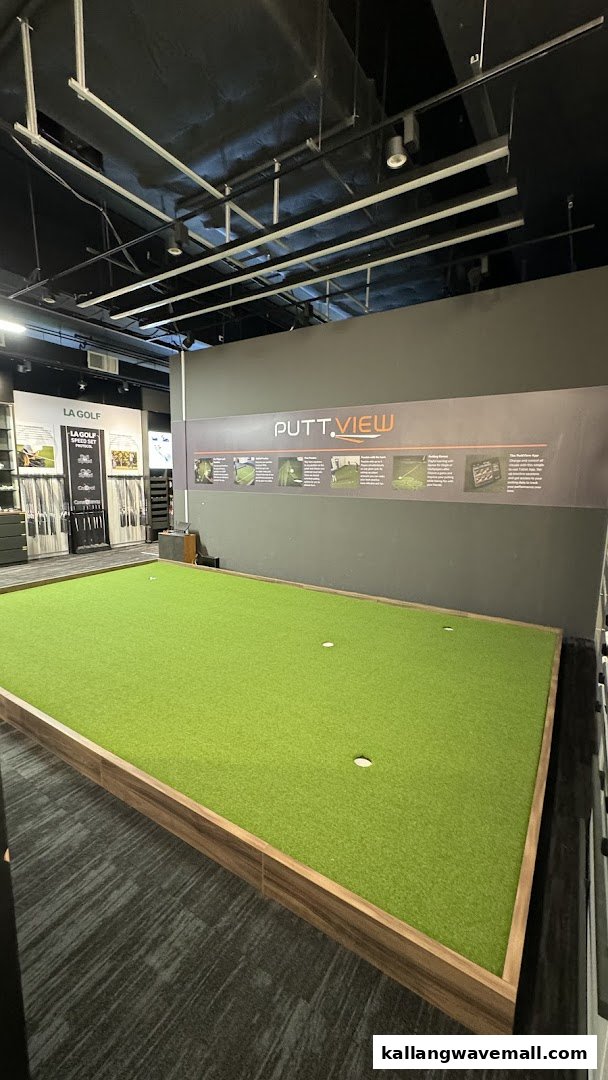 An indoor golf putting green with a 'Putt.View' display and golf equipment on display at Lip Golf.