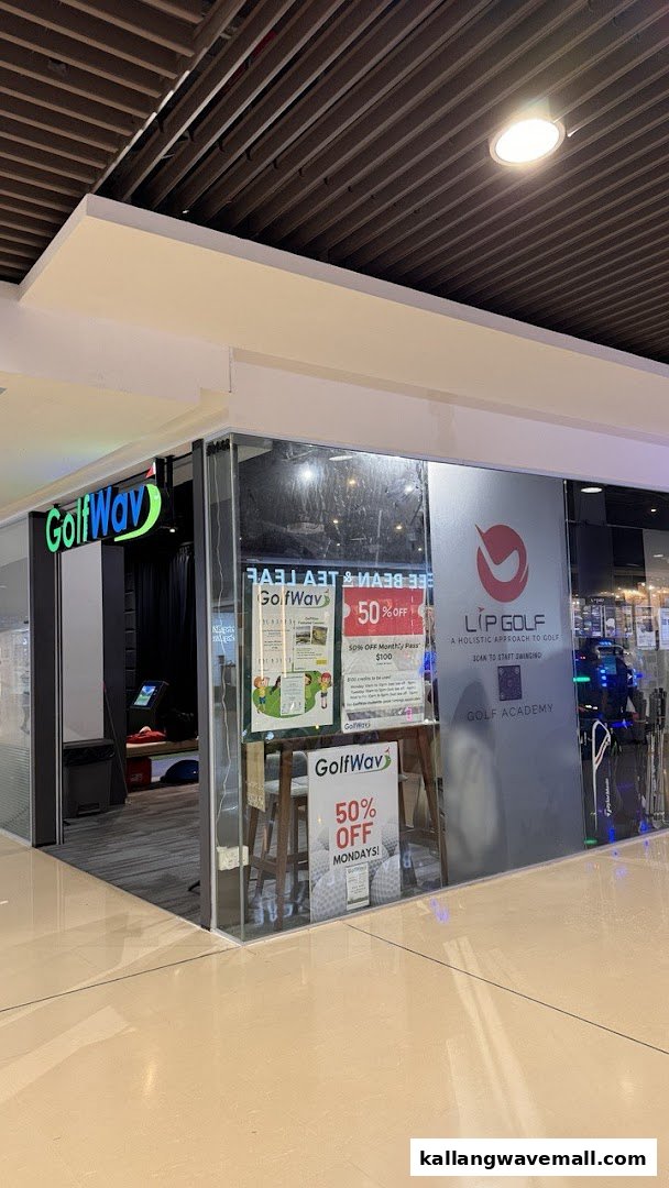 The modern storefront of Lip Golf / GolfWav, a golf academy and simulator, with promotional signs.
