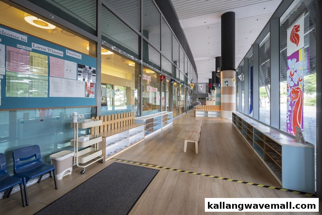 The bright, welcoming entrance hallway of Lorna Whiston Preschool, featuring glass walls and bulletin boards.