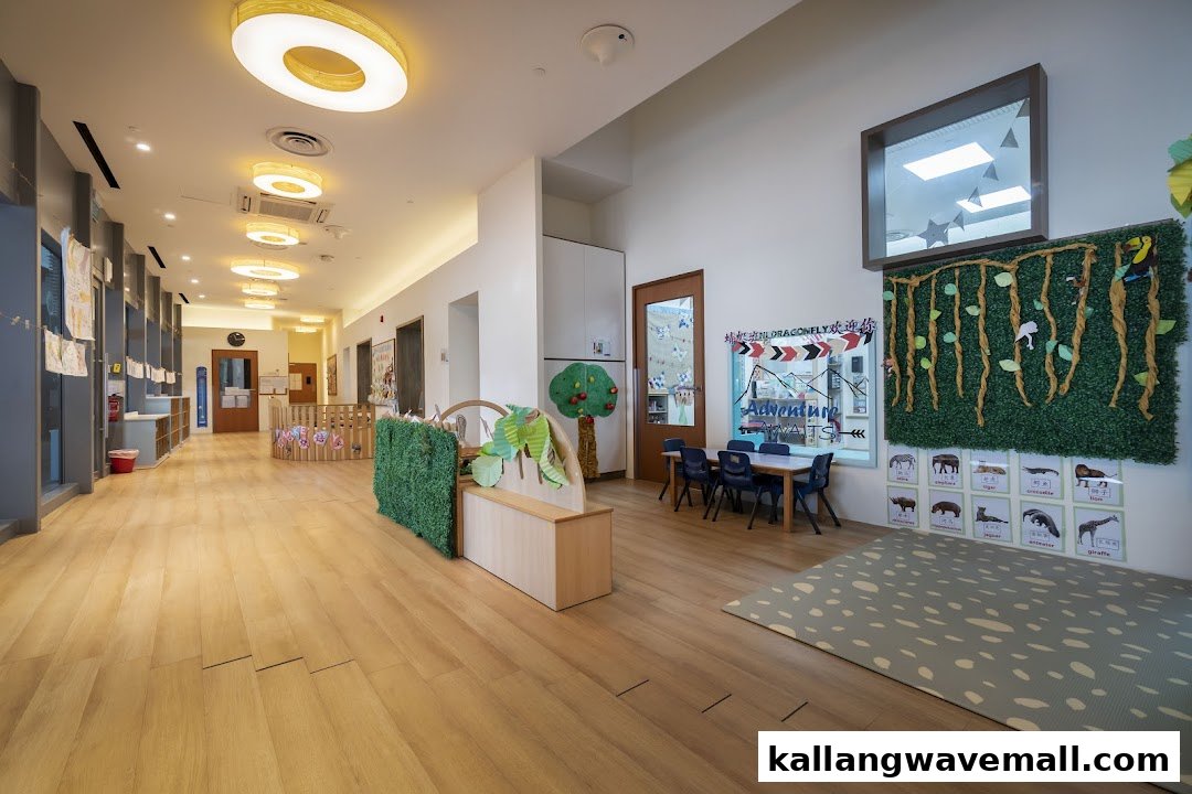 A bright, spacious hallway with child-friendly decor and learning areas inside a preschool.
