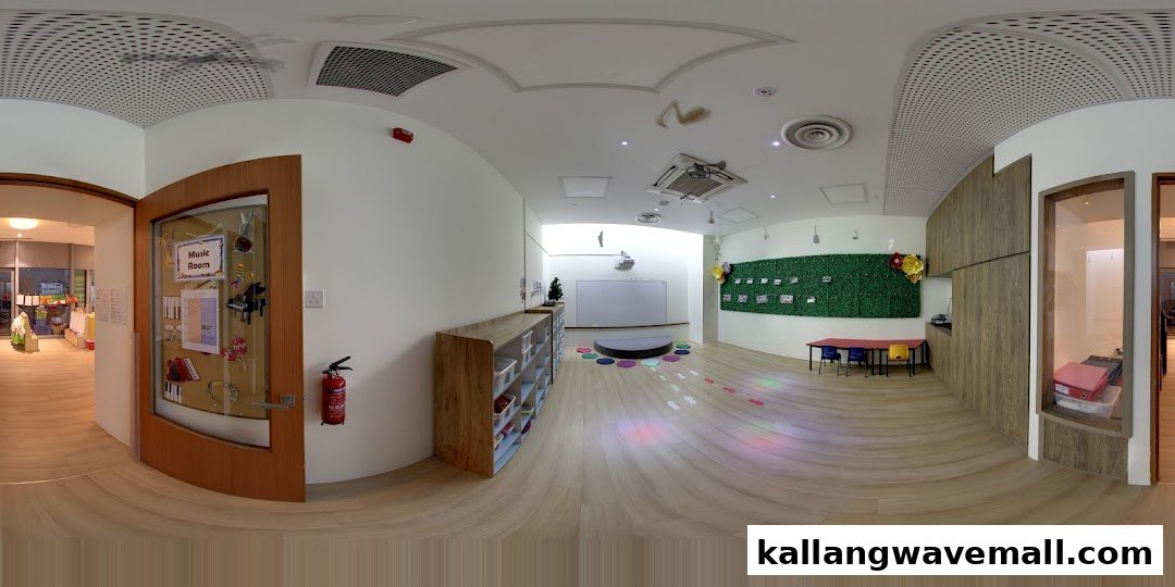 A bright, spacious preschool classroom featuring a 'Music Room' door, activity areas, and storage.