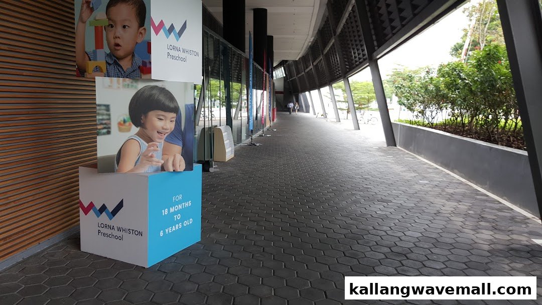 Promotional banners for Lorna Whiston Preschool at Kallang Wave, featuring children and age range.