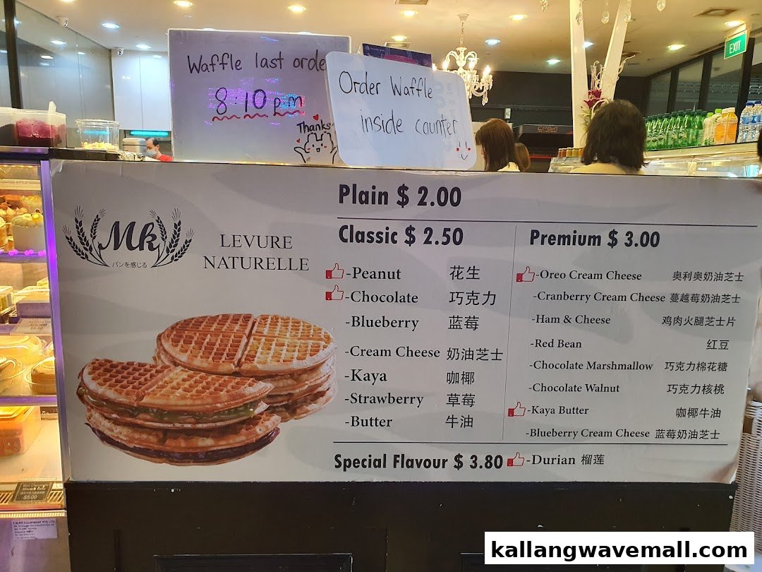 A menu board for MK Levure Naturelle, showcasing various waffle flavors and prices.