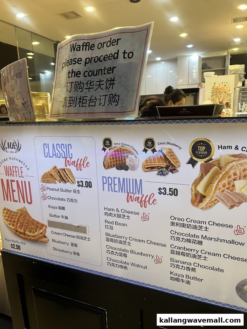 A vibrant menu board displaying various waffle flavors and prices, with ordering instructions.