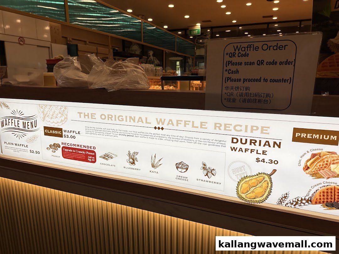 A brightly lit menu board displaying classic and premium waffle options, flavors, and ordering instructions.