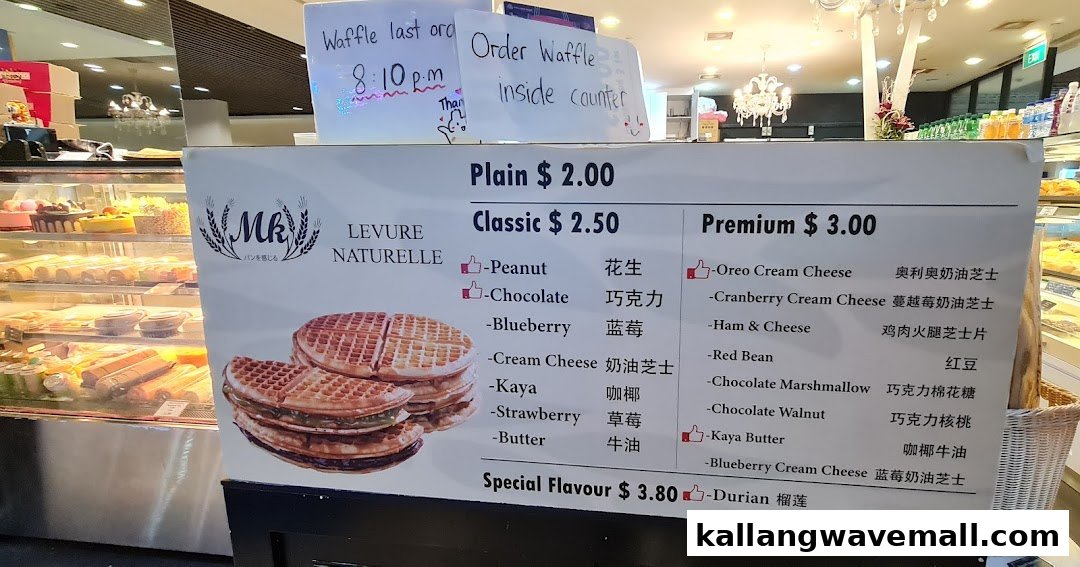 A detailed menu board for waffles at MK Levure Naturelle, showing various flavors and prices.