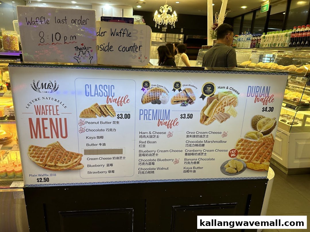 A vibrant menu board for MK Levure Naturelle, showcasing various waffle flavors and prices.