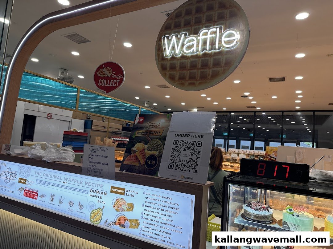 An inviting interior view of a waffle shop counter featuring a menu board and display case.