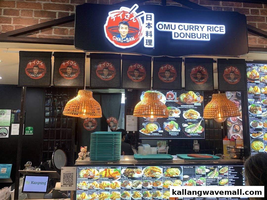A vibrant Japanese food stall counter featuring illuminated menu displays and traditional decor.