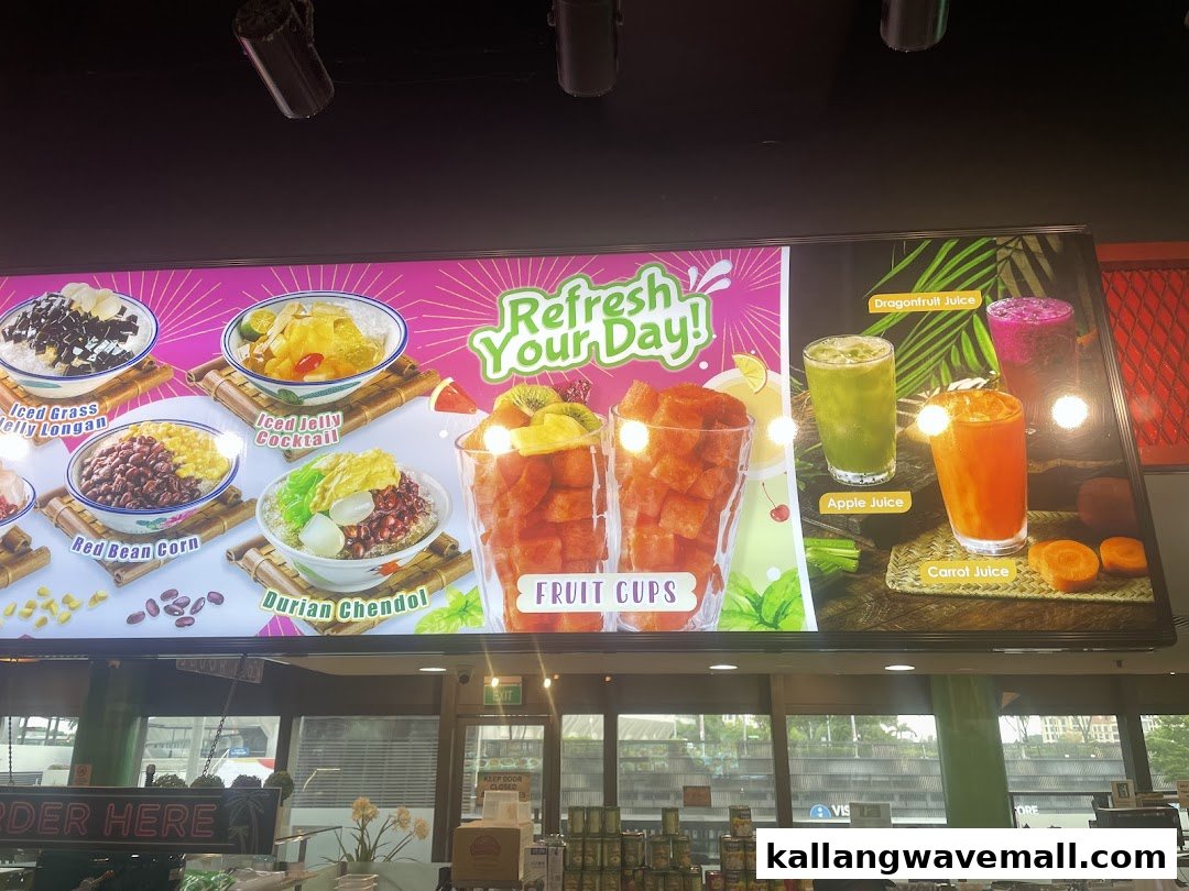 A vibrant digital menu board displaying various refreshing desserts, fruit cups, and fresh juices.