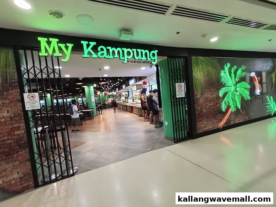 The vibrant green entrance of My Kampung food court, showcasing its inviting interior and unique decor.